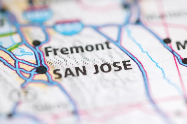 Close-up of a printed map highlighting San Jose and Fremont locations.