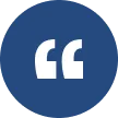 Icon of white quotation marks inside a dark blue circle.